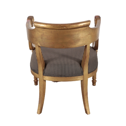 276 - A PAIR OF EMPIRE STYLE GILTWOOD ARMCHAIRS AFTER THOSE BY JACOB FRERES 20th century, each of the arms... 