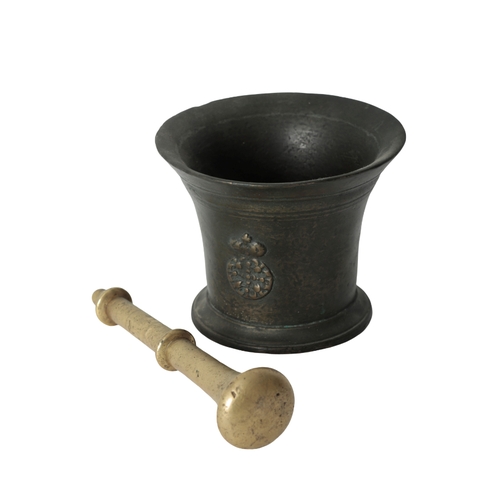 283 - A LATE 17TH CENTURY BRONZE MORTAR WITH PESTLE with a flared rim over a tapering body, with applied c... 