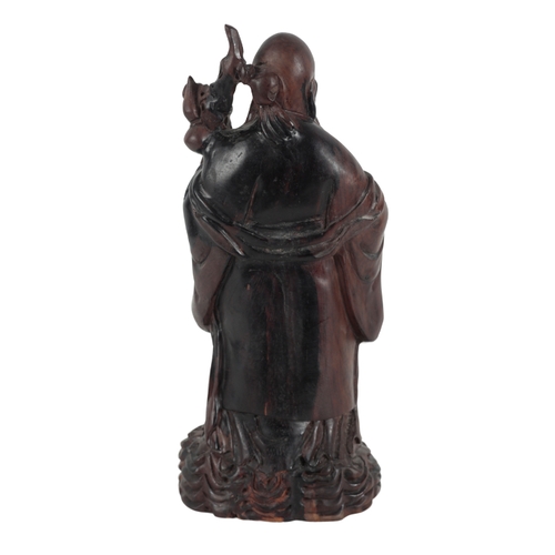 285 - A CHINESE CARVED HARDWOOD FIGURE OF SHOULAO, QING DYNASTY early 20th Century, 39cm high