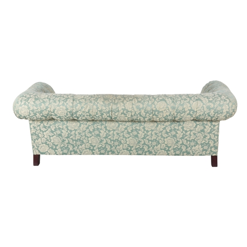 325 - A PAIR OF MODERN CHESTERFIELD TYPE SOFAS with floral print button back damask covers, on turned stai... 