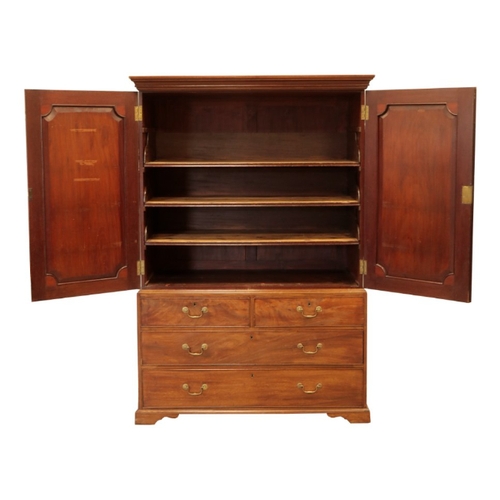 340 - A GEORGE III MAHOGANY LINEN PRESS the top section with panelled doors with applied paterae to each c... 