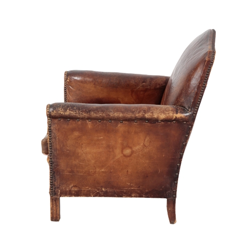 342 - A FRENCH ARMCHAIR early 20th century, with studded leather covers, on moulded front legs, 85cm high ... 