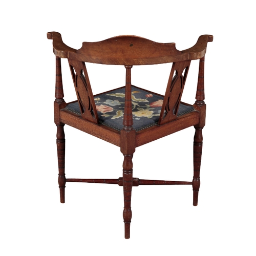 347 - AN EDWARDIAN MAHOGANY CORNER ARMCHAIR inlaid with paterae to the cresting rail and back splats, with... 