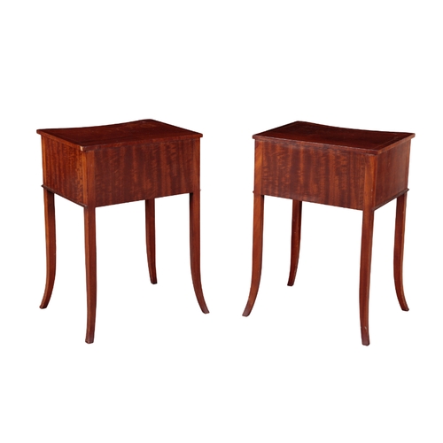 352 - A PAIR OF EDWARDIAN MAHOGANY BEDSIDE TABLES with inverted bow fronts, the two short drawers above sl... 