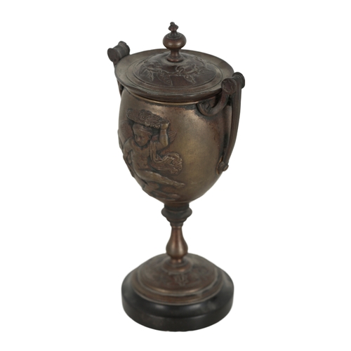 160 - A BRONZE TWO-HANDLED CUP AND COVER 19th century, probably Italian, each side cast in relief with dan... 