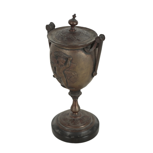 160 - A BRONZE TWO-HANDLED CUP AND COVER 19th century, probably Italian, each side cast in relief with dan... 