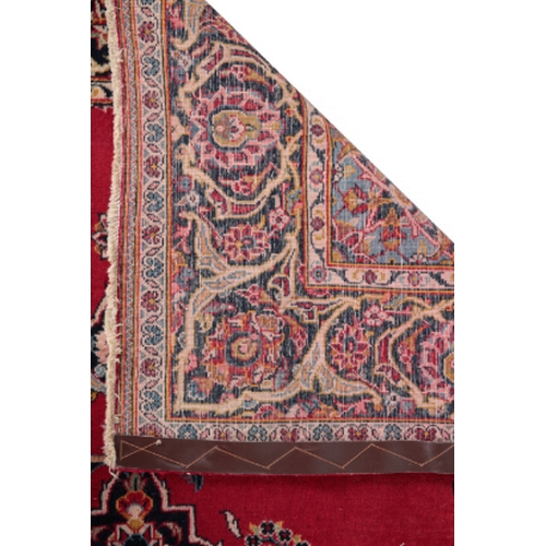 170 - A CENTRAL PERSIAN KASHAN RUG woven in yellow, pale and dark blue, pink and other colours with double... 