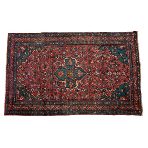 181 - A NORTH WEST PERSIAN MALAYER RUG woven in blue, green and orange with central cruciform medallion an... 