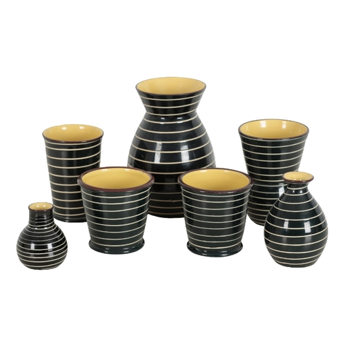 182 - A COLLECTION OF BABBACOMBE STUDIO CERAMICS black glazed with white spiral pattern, and yellow glazed... 