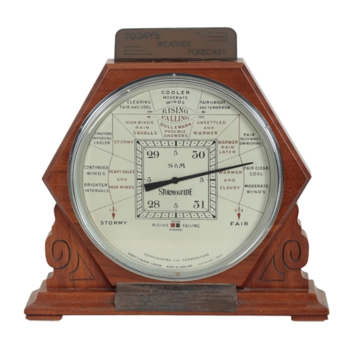 200 - A 'STORMOGUIDE' BAROMETER BY SHORT AND MASON, LONDON copyright 1932, within an art deco style walnut... 