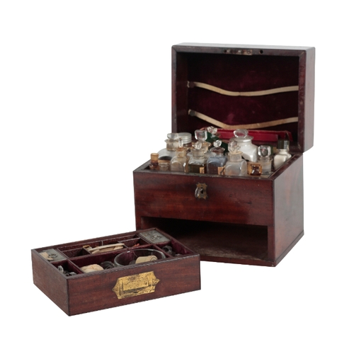 208 - AN EARLY 19TH CENTURY MAHOGANY AND BRASS APOTHECARY CHEST the hinged lid opening to reveal an array ... 