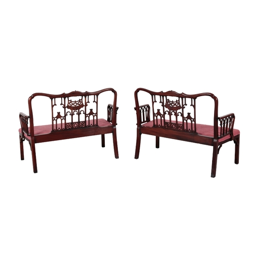 221 - A PAIR OF 'CHINESE CHIPPENDALE' MAHOGANY SETTEES 20th century, each with shaped cresting rails over ... 