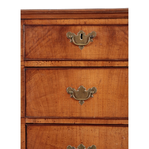 239 - A GEORGE III WALNUT CHEST OF DRAWERS with a crossbanded top, over two short and three long drawers, ... 