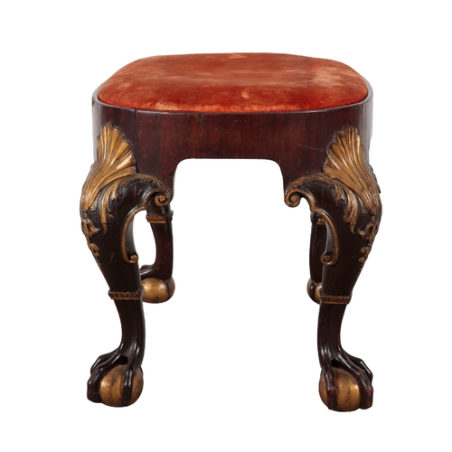 243 - A GEORGE I STYLE MAHOGONY AND PARCEL GILT STOOL 19th century, the oval top with velvet covered drop-... 