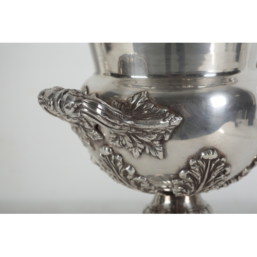 32 - A PAIR OF SILVER-PLATED CHAMPAGNE COOLERS of campagna urn form, the body decorated with vinery and g... 