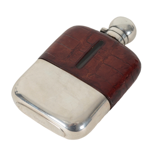 40 - A SILVER PLATED AND CROCODILE LEATHER HIP FLASK 15cm high; together with a horn beaker with silver c... 