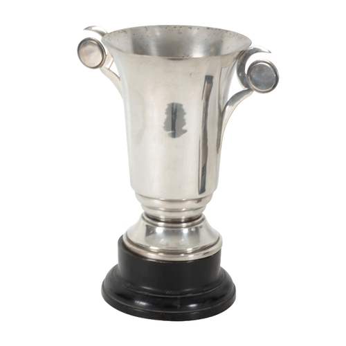 42 - A SILVER PLATED RUGBY TROPHY P.T.A. Inter-House Rugby trophy, modelled as a ball on a rectangular ba... 