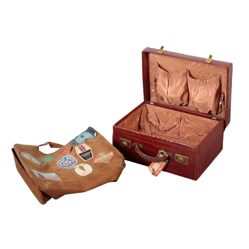 52 - AN EDWARDIAN CROCODILE SUITCASE with a brown silk lining, brass locks and canvas outer case, togethe... 