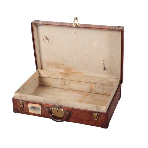 59 - LOUIS VUITTON: A  LEATHER TRAVEL CASE circa 1921, the brass lock inscribed 