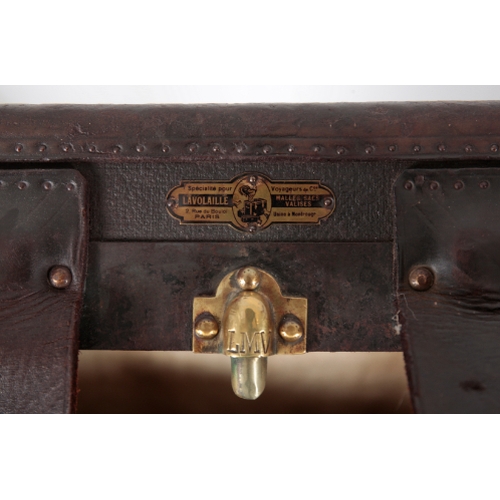 71 - MALLE LAVOLAILLE, PARIS: A CANVAS AND LEATHER, BRASS AND WOOD-BOUND TRUNK with leather carrying stra... 