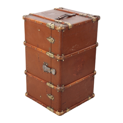 72 - A LARGE TRAVEL TRUNK with wood and brass banding, and side carrying handles, the side with remains o... 