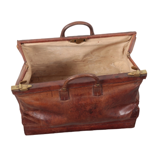 77 - J.W. HILL OF HAYMARKET, LONDON: A LARGE DARK BROWN LEATHER GLADSTONE BAG with a suitcase bottom, bra... 