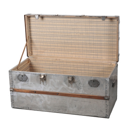 79 - A FRENCH ALUMINIUM AND WOOD-BANDED TRUNK the hinged lid opening to a paper-lined vacant interior, 48... 