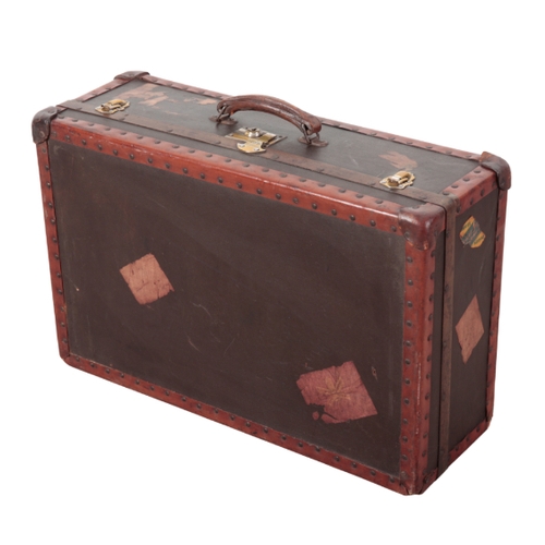 82 - A FIBRE AND LEATHER-TRIM TRAVEL CASE remains of labels on the exterior, 68.5cm x 43.5cm x 24cm

Prov... 