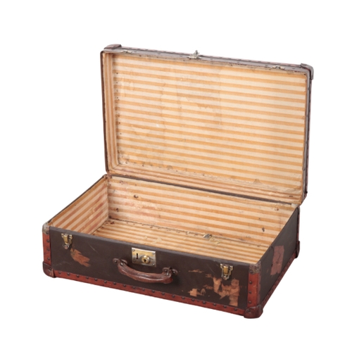 82 - A FIBRE AND LEATHER-TRIM TRAVEL CASE remains of labels on the exterior, 68.5cm x 43.5cm x 24cm

Prov... 