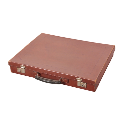 83 - AN EDWARDIAN BROWN LEATHER MASONIC SUITCASE with nickel lock fittings; a canvas and leather single g... 