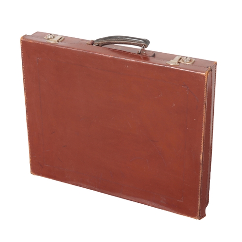 83 - AN EDWARDIAN BROWN LEATHER MASONIC SUITCASE with nickel lock fittings; a canvas and leather single g... 