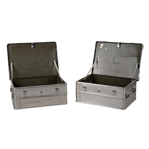 86 - A PAIR OF ZAGRES ALUMINIUM AND WOOD BANDED TRUNKS with hinged lids opening to vacant interiors, 32.5... 