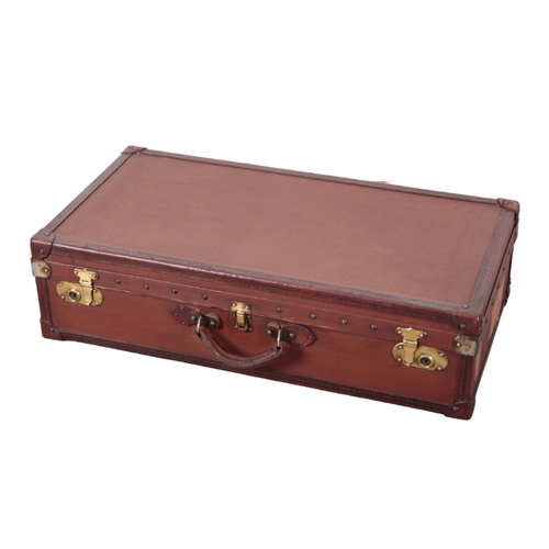 87 - AN EDWARDIAN LIGHT BROWN LEATHER-EFFECT SUITCASE with brass corners and locks; and a dark brown leat... 