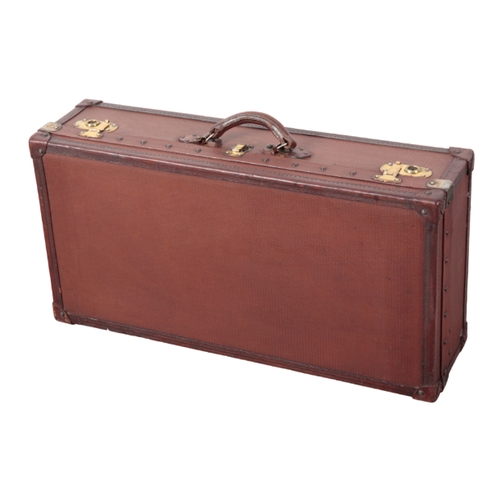 87 - AN EDWARDIAN LIGHT BROWN LEATHER-EFFECT SUITCASE with brass corners and locks; and a dark brown leat... 