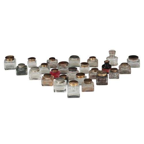 94 - A COLLECTION OF TWENTY FIVE INKWELLS of varying forms (a lot)

Provenance: The Keith Walton collecti... 