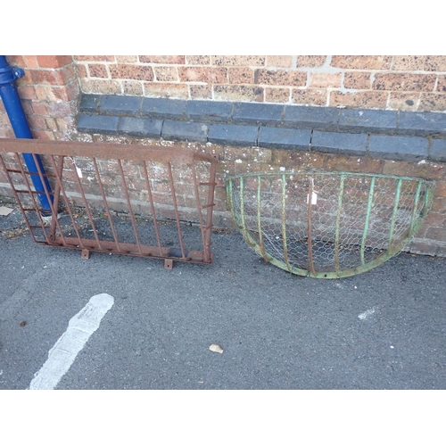 3 - A VINTAGE IRON HAY MANGER, PAINTED GREEN and another similar, each 90cm wide