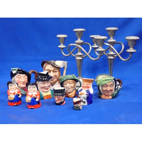 106 - A COLLECTION OF CHARACTER JUGS, ROYAL DOULTON AND OTHERS and a pair of silver-plated candelabra