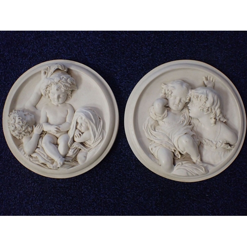 116 - A PAIR OF CLASSICAL STYLE RESIN ROUNDELS