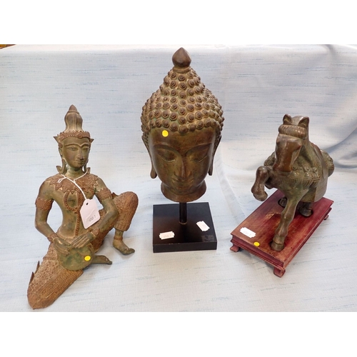 337 - A HINDU BRONZE HEAD ON STAND 31cm high, and two similar bronzes