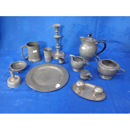 109 - A HAMMERED PEWTER TEA SET together with other pewter wares