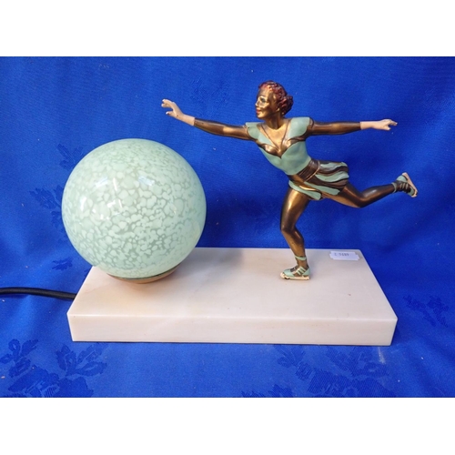 241 - AN ART DECO DESK LAMP - THE SKATER modelled with cold painted metal figure and spherical mottled gla... 