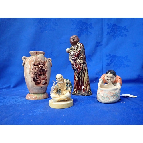 290 - A JAPANESE POTTERY FIGURE OF A FISHERMAN HAULING IN A NET 9cm high, and three other items