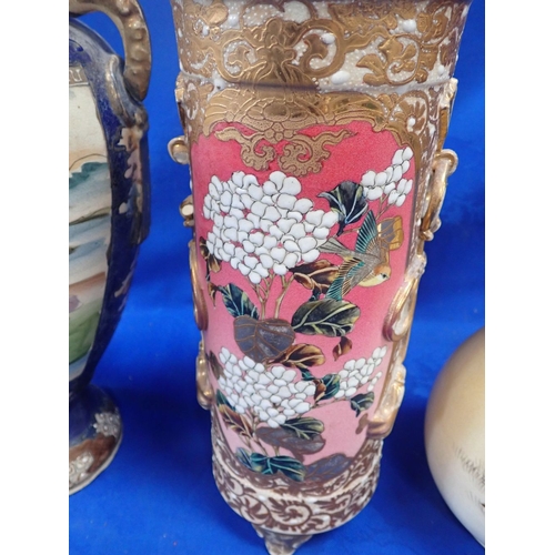 292 - THREE EARLY 20TH CENTURY JAPANESE VASES one with long flared neck painted with birds amongst flowers... 