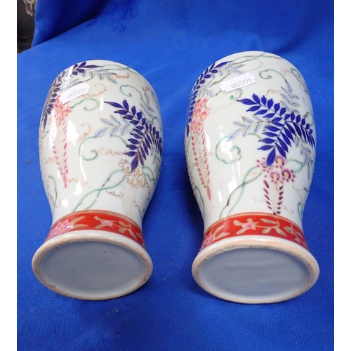 330 - A PAIR OF CHINESE FAMILLE NOIR SLEEVE VASES decorated the peacocks amongst cherry blossom, 20.5cm hi... 