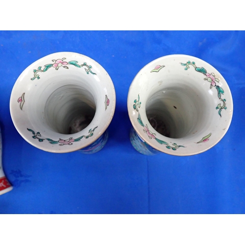 330 - A PAIR OF CHINESE FAMILLE NOIR SLEEVE VASES decorated the peacocks amongst cherry blossom, 20.5cm hi... 