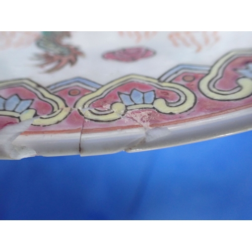 331 - A CHINESE ENAMEL DECORATED BOWL with dragons amongst clouds, 28cm diameter