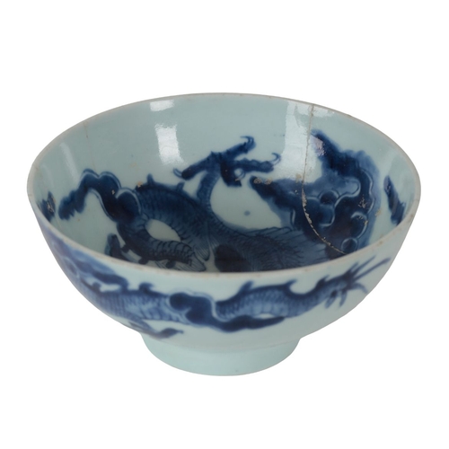 353 - A CHINESE BLUE AND WHITE BOWL Kangxi, decorated with dragons amongst clouds, 15.5cm wide x 7.5cm hig... 