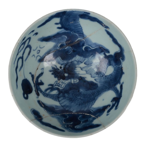 353 - A CHINESE BLUE AND WHITE BOWL Kangxi, decorated with dragons amongst clouds, 15.5cm wide x 7.5cm hig... 