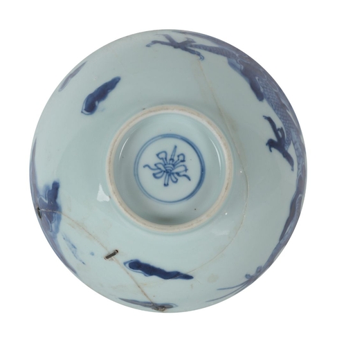 353 - A CHINESE BLUE AND WHITE BOWL Kangxi, decorated with dragons amongst clouds, 15.5cm wide x 7.5cm hig... 