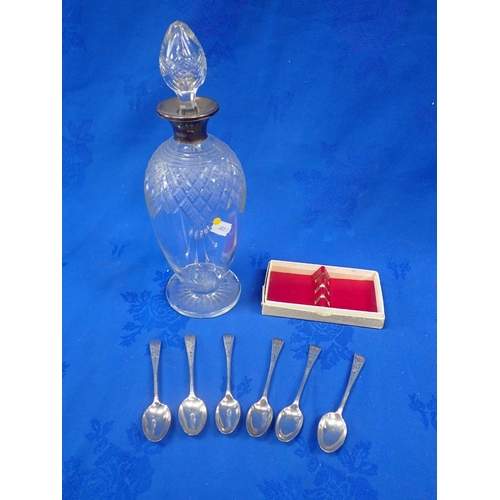 406 - A SILVER COLLARED CUT-GLASS DECANTER and six silver teaspoons (three each of two similar patterns)